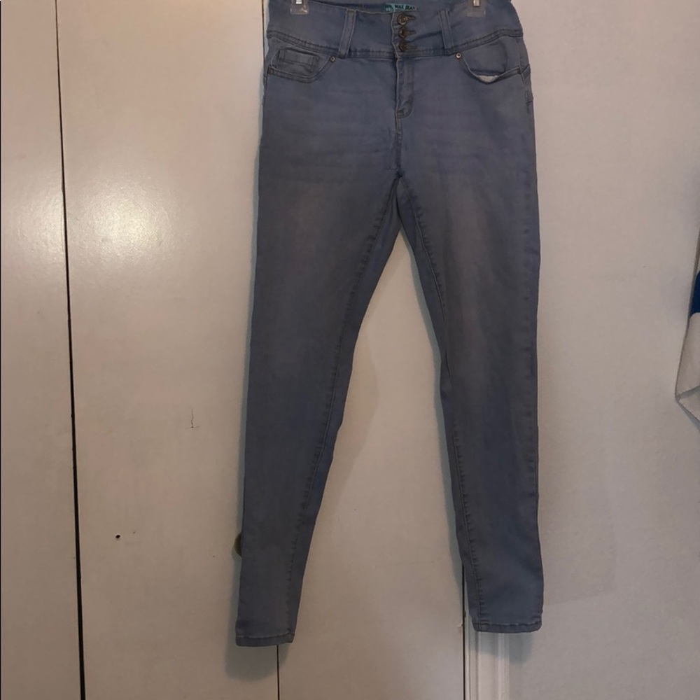 A pair of light washed skinny jeans